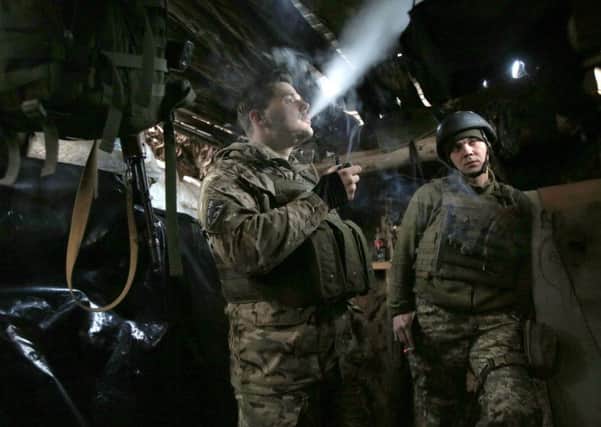 Ukrainian soldiers in a dugout on the front line, near Avdiivka, in Donetsk region (Picture: Anatolii Stephanov/AFPGetty Images)