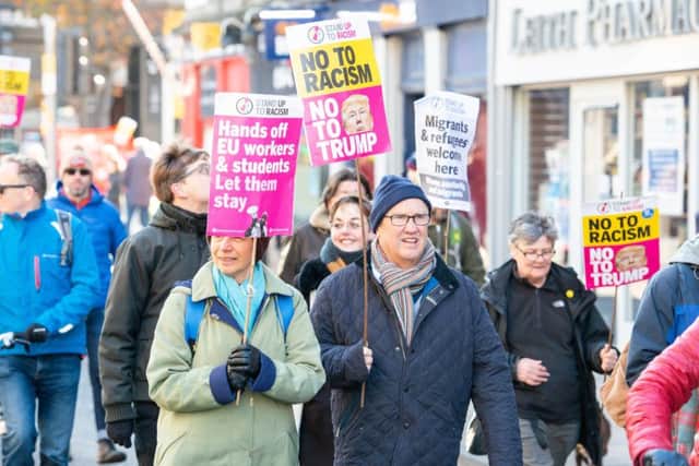 Anti-racism protesters stage a march in Leith to say migrants are welcome (Picture: Ian Georgeson)