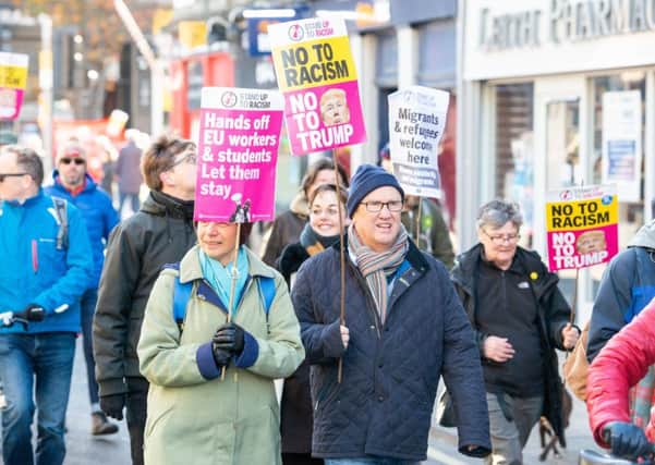 Anti-racism protesters stage a march in Leith to say migrants are welcome (Picture: Ian Georgeson)