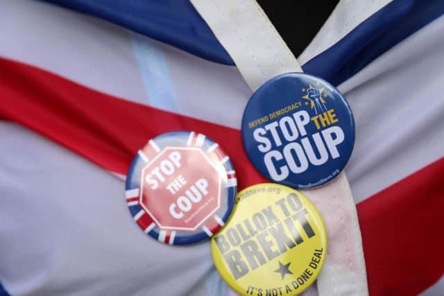 Anti-Brexit protesters demonstrate outside the Houses of Parliament in London. (AP Photo/Matt Dunham)