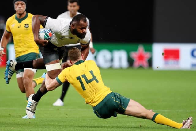 Pecali Yato of Fiji is tackled by Australias Reece Hodge. Picture: Getty.