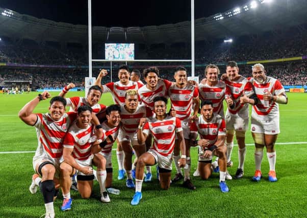 Japan's players celebrate victory over Ireland. Picture: William West/AFP/Getty Images