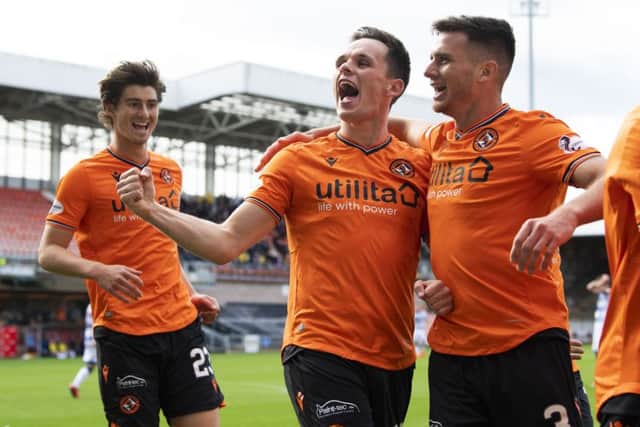 Dundee United's Lawrence Shankland (centre) celebrates his second goal with Adrian Sporle. Picture: SNS