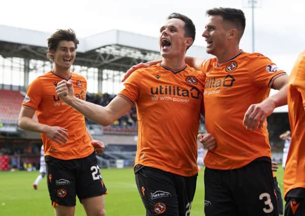 Dundee United's Lawrence Shankland (centre) celebrates his second goal with Adrian Sporle. Picture: SNS