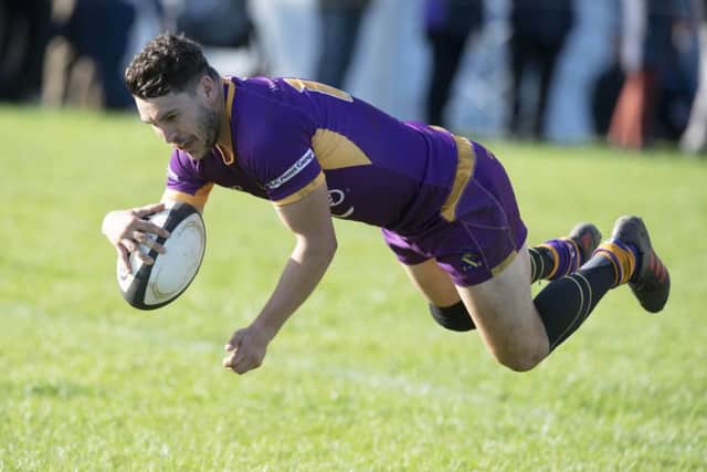 Marr's Colin Sturgeon runs through for a try against Currie. Picture: Ross Brownlee/SNS