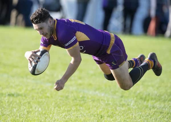 Marr's Colin Sturgeon runs through for a try against Currie. Picture: Ross Brownlee/SNS
