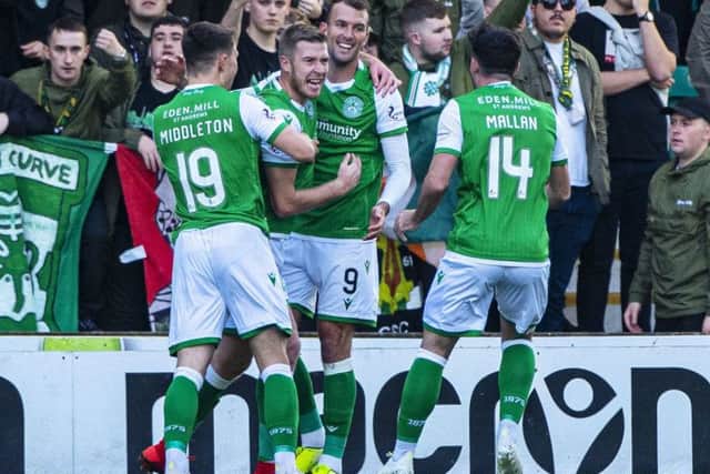 Christian Doidge (No 9) celebrates with team-mates after Kristoffer Ajer turned in his cut-back to give Hibs an early lead against Celtic on Saturday. Picture: Bill Murray/SNS