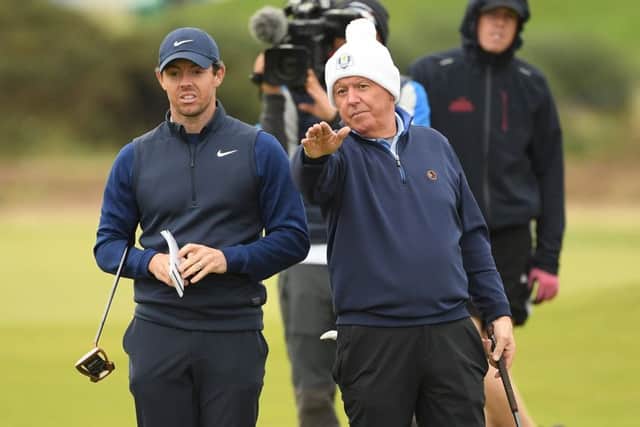 Rory McIlroy lines up a putt with dad Gerry on the ninth hole in the final round of the Alfred Dunhill Links Championship at The Old Course. Picture: Ross Kinnaird/Getty