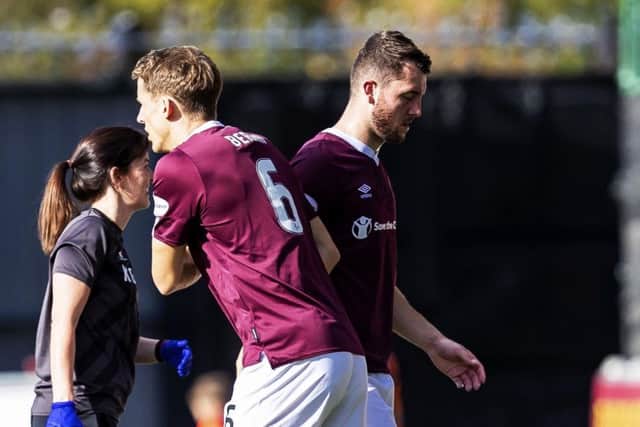 Hearts defender Craig Halkett is replaced by Christophe Berra after suffering a knee injury against St Mirren. Picture: Roddy Scott/SNS