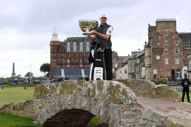Frenchman Victor Perez lifts the Alfred Dunhill Links Championship trophy on the Swilken Bridge in St Andrews. Picture: Ross Kinnaird/Getty Images