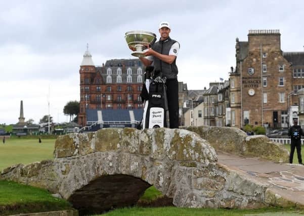 Frenchman Victor Perez lifts the Alfred Dunhill Links Championship trophy on the Swilken Bridge in St Andrews. Picture: Ross Kinnaird/Getty Images