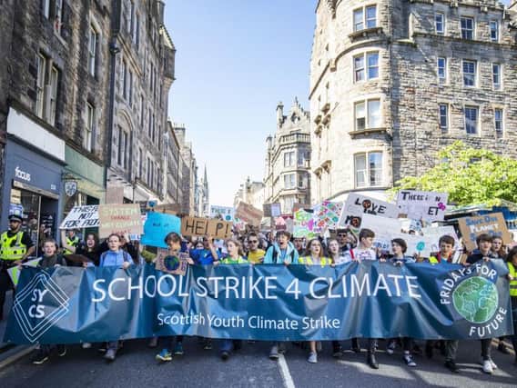 Students take part in the Scottish Youth Climate Strike, in Holyrood, Edinburgh, to demand urgent action to tackle climate change. Picture: PA