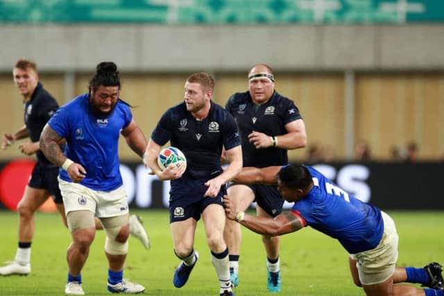 Finn Russell probes at the Samoan defence during Scotland's 34-0 win in Kobe. Picture: Getty Images