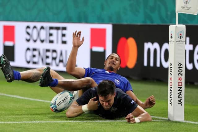 Scotland wing Sean Maitland is challenged illegally by Samoa's Ed Fidow before he can touch down for Scotland's fourth try, which was awarded as a penalty try. Picture: Getty Images