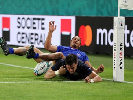 Scotland wing Sean Maitland is challenged illegally by Samoa's Ed Fidow before he can touch down for Scotland's fourth try, which was awarded as a penalty try. Picture: Getty Images