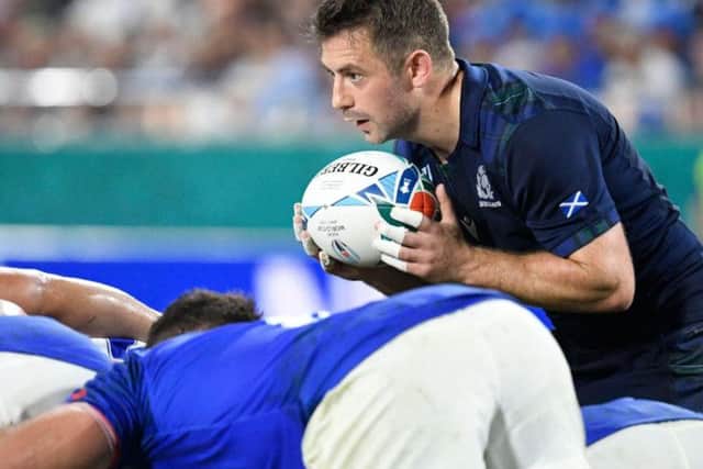 Greig Laidlaw preapres to feed a scrum during the Pool A match