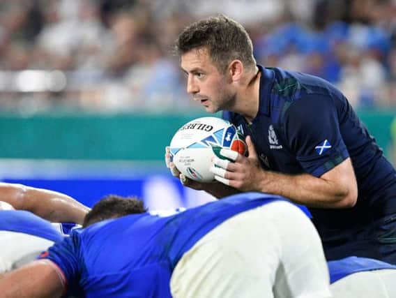 Greig Laidlaw preapres to feed a scrum during the Pool A match