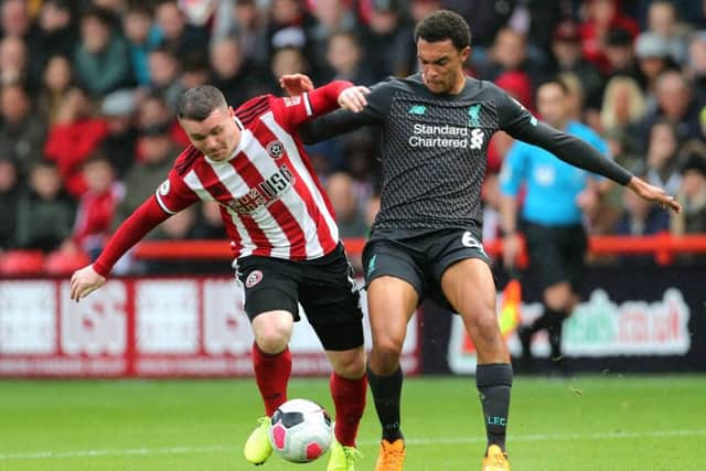 John Fleck, battling here with Liverpool's Trent Alexander-Arnold on Saturday, is set to be named in Steve Clarke's latest Scotland squad. Picture: PA.