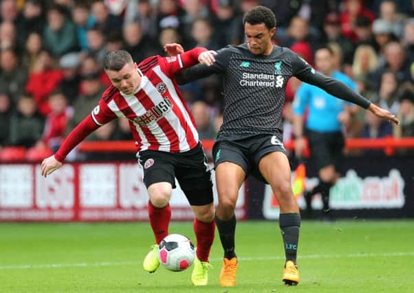 John Fleck, battling here with Liverpool's Trent Alexander-Arnold on Saturday, is set to be named in Steve Clarke's latest Scotland squad. Picture: PA.