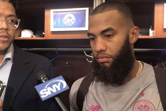 Amed Rosario (right) wearing Celtic's change kit in the Mets' locker room