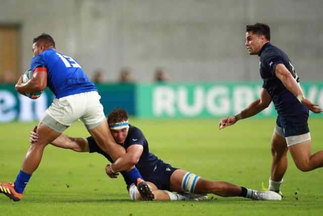 Scotland star man Jamie Ritchie puts in a tackle on Samoa centre Alapati Leiua in Kobe on Monday. Picture: Getty Images