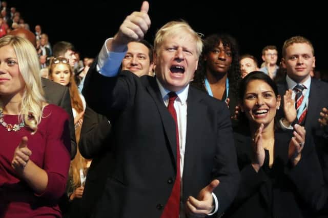 Prime Minister Boris Johnson gives a thumbs up at the Conservative Party conference in Manchester