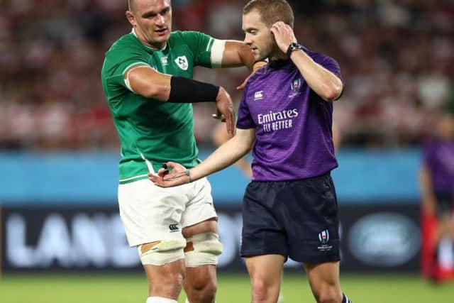 Ireland's Rhys Ruddock exchanges words with referee Angus Gardner