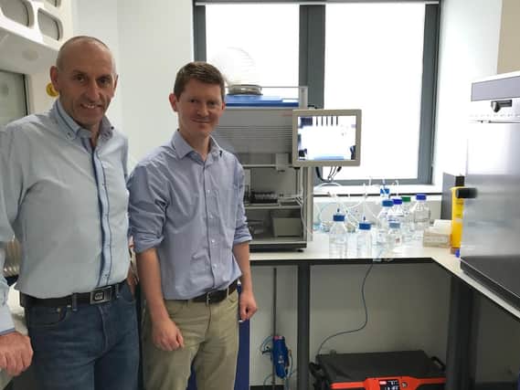 Vert's John McNeil with Scott Denham at the mass spectrometry core laboratory. Picture: Contributed
