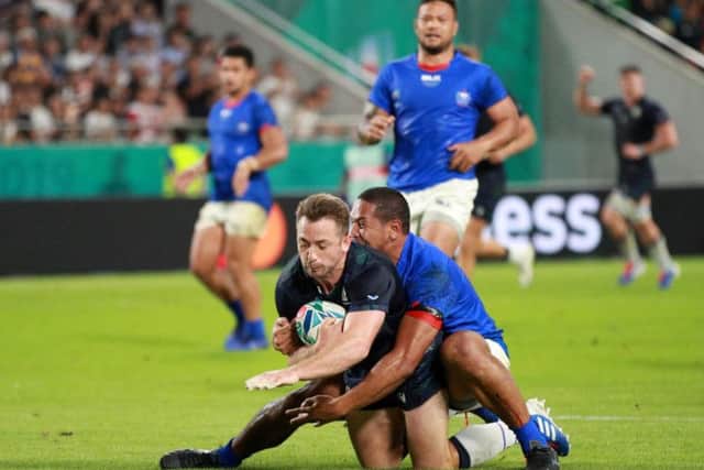 Greig Laidlaw shows strength and determination to get over the line for Scotland's second try on Monday. Picture: Getty Images