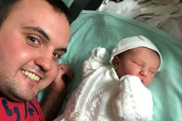 Mechanic Calum Stewart, 28, with his daughter Hannah. Picture: SWNS