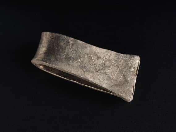 The silver arm ring that carries the runic inscription for  'Egbert'. PIC: NMS.