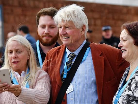 Boris Johnson's father, Stanley Johnson, poses for selfies at the Conservative conference in Manchester