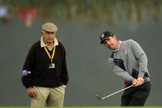 Padraig Harrington, right, is watched by coach Bob Torrance during a practice session for the 2010 Ryder Cup at Celtic Manor in Wales.
Picture: Glyn Kirk/AFP/Getty