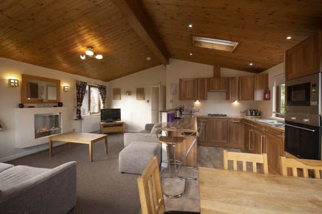 A main living space with kitchen, dining and lounge areas, and two separate bedrooms and a bathroom make the lodges at Parkdean Resorts Tummel Valley site a good option for family holidays