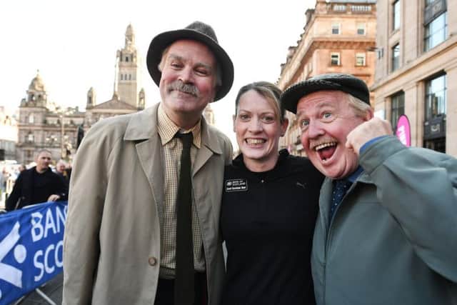 Eilidh Doyle with Still Game stars Ford Kiernan and Greg Hemphill at the Great Scottish Run. Picture: John Devlin