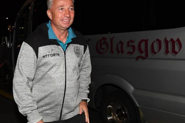 Cluj manager Dan Petrescu took ill after arriving in Glasgow. Picture: SNS