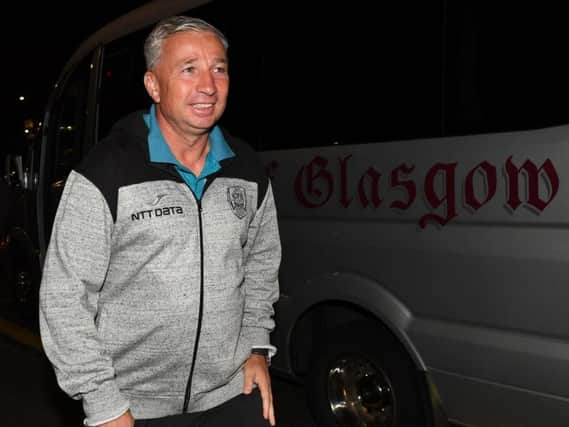 Cluj manager Dan Petrescu took ill after arriving in Glasgow. Picture: SNS