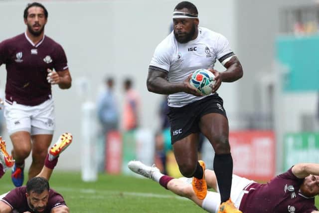 Fiji's Levani Botia makes a break through the Georgia backs