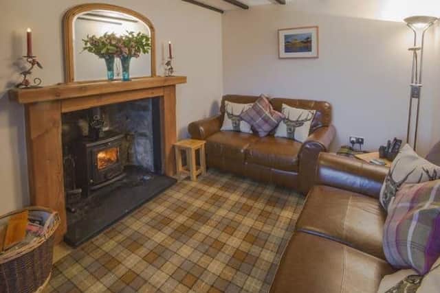 Soak up some tranquility on the shores of Lochinver at this traditional self-catering holiday cottage, which is tastefully furnished with a warming wood burning stove and modern fittings to make you feel right at home