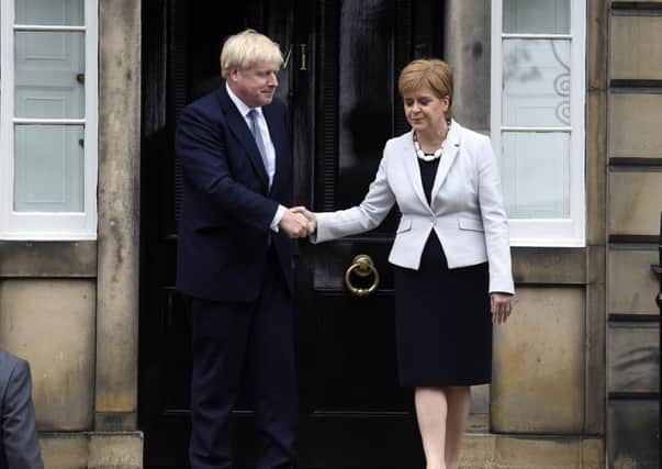 Boris Johnson meets Nicola Sturgeon on the steps of Bute House (Picture: Lisa Ferguson)