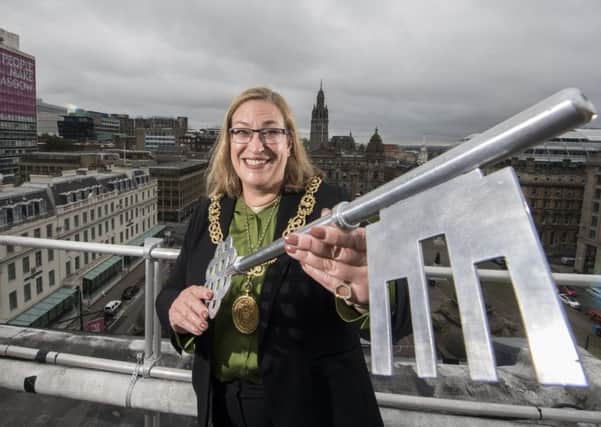 Glasgow's Lord Provost Eva Bolander with the giant key to the big box of 23 shoes she claimed on expenses (Picture: John Devlin)