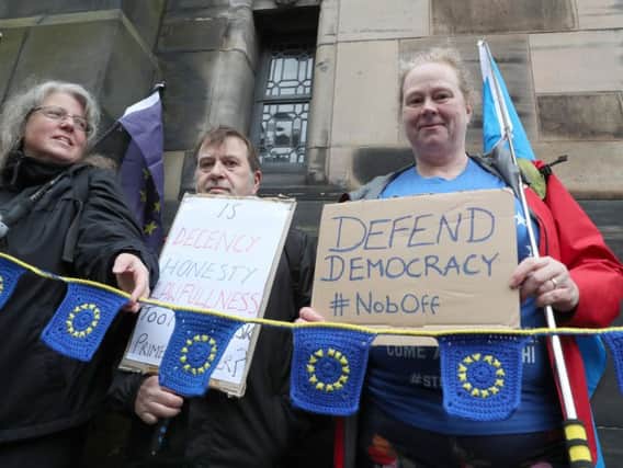 Pro-EU protesters gather outside the Court of Session in Edinburgh