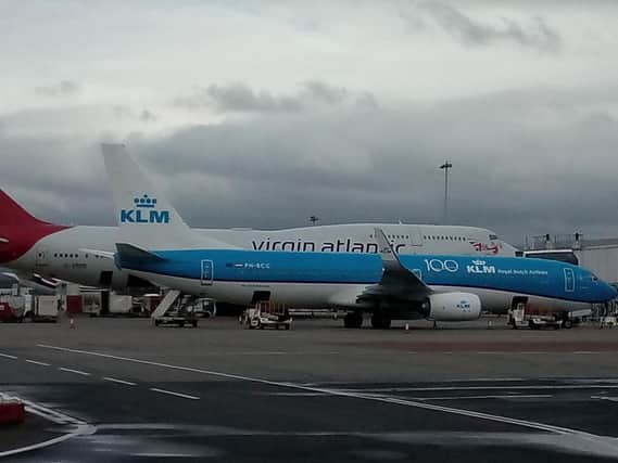 Emergency service crews are attending to a KLM aircraft from Amsterdam. Picture: John Devlin