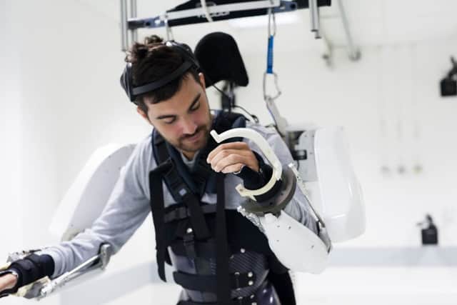 A 28-year-old tetraplegic man known only as Thibault controls an exoskeleton with brain signals. Picture: Clinatec/Juliette Treillet