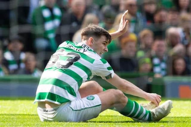 Kieran Tierney pulls up injured while playing for Celtic.