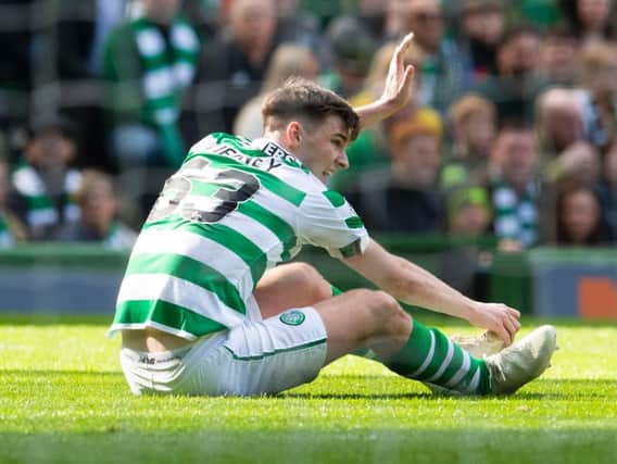 Kieran Tierney pulls up injured while playing for Celtic.