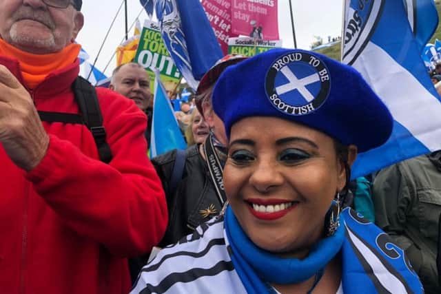 A woman wears a "Proud to be Scottish" bonnet to the march. PIC: Lisa Ferguson.