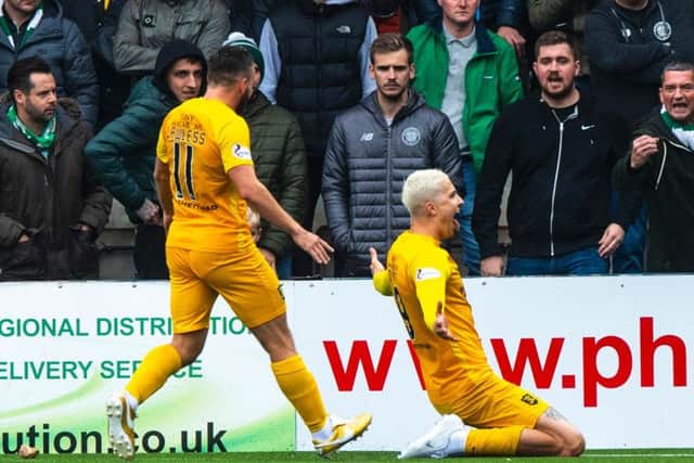 Lyndon Dykes celebrates having put his side 2-0 up. Picture: SNS
