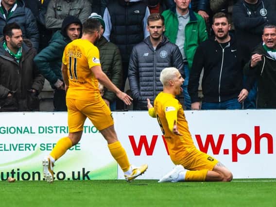 Lyndon Dykes celebrates having put his side 2-0 up. Picture: SNS