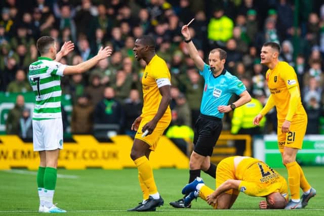 Ryan Christie is shown a red card by referee Willie Collum. Picture: SNS